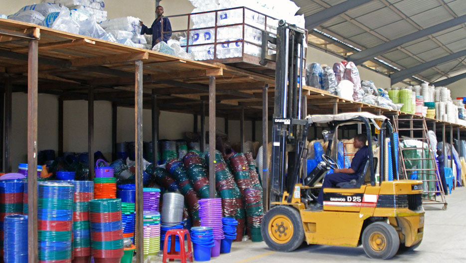 Complast employees working at the factory